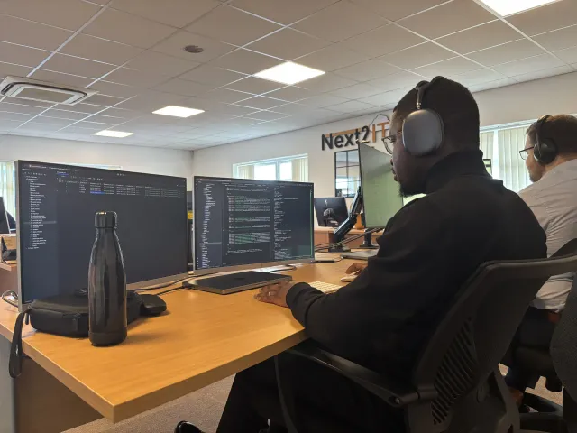 The Next2Software team collaborating in the office.