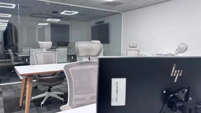 A tidy office with desks where a team manages business operations.