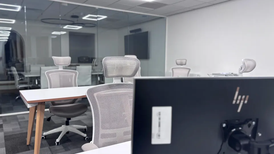 A tidy office with desks where a team manages business operations.